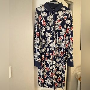 Darkblue white,and red color.One of the sleeves without bottom.New without tag.